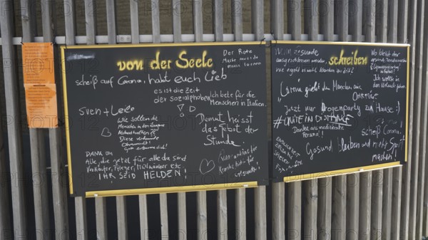 Blackboard written in chalk with various messages and notes during Corona, Berlin