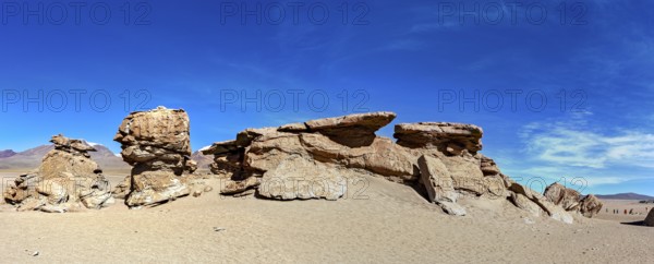 Wide panoramic view of impressive rock formations in the desert under a blue sky, The landscape of the Altiplano in Bolivia