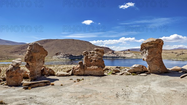 Clear water surrounded by rocks under a sunny, cloudless sky, The Altiplano landscape in Bolivia