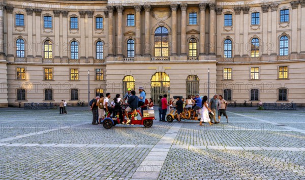 Tourist group with guides on Bebelplatz in Mitte, Berlin, Germany