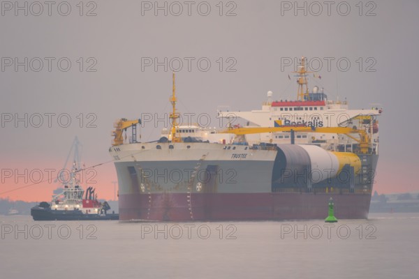 A semi-submersible ship is towed from the Weser to the North Sea, Bremerhaven, Bremen, Germany