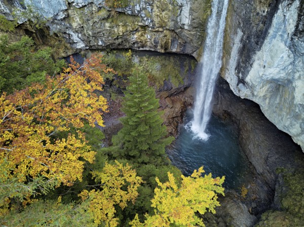 Aerial view of Berglistüber waterfall in autumn-colored surroundings, Linthal, Klausenpass, Canton of Glarus, Switzerland