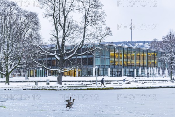 Exterior view of the state parliament building with Eckensee and television tower. Winter in Stuttgart. The city is wintry white early in the morning. Stuttgart, Baden-Württemberg, Germany