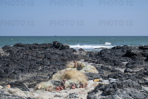 Garbage, fishing nets and plastic on the beach, Oman