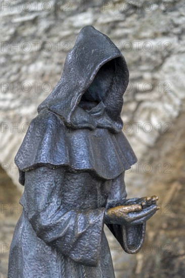 Monk sculpture, one of three bronze statues of faceless monks at the Danish King's Garden in the Old Town of the city Tallinn, Harju County, Estonia