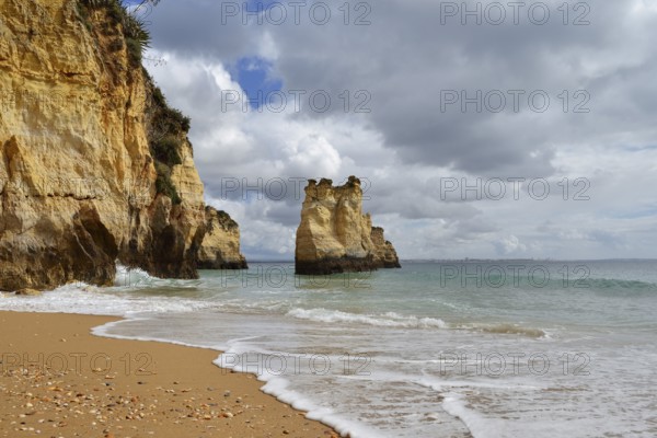 Rocky coast and beach, Praia do Pinhao, Lagos, Algarve, Portugal