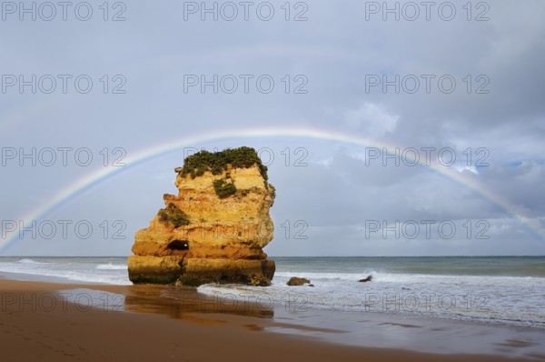 Rocks on beach with rainbow, Praia Dona Ana, Lagos, Algarve, Portugal