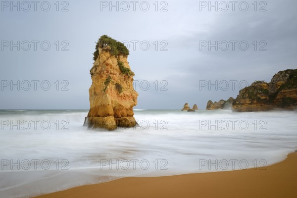 Rocks on the coast in the surf, Praia Dona Ana, Lagos, Algarve, Portugal