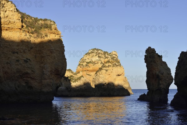 Rocky coast in evening light, Ponta da Piedade, Lagos, Algarve, Portugal