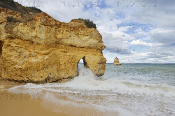 Rocky coast and beach in the surf, Praia do Camilo, Lagos, Algarve, Portugal