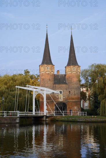 Oostpoort city gate and drawbridge on the Delftse Schie, Delft, South Holland, Netherlands