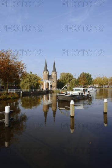 Oostpoort city gate and ship on the Delftse Schie, Delft, South Holland, Netherlands