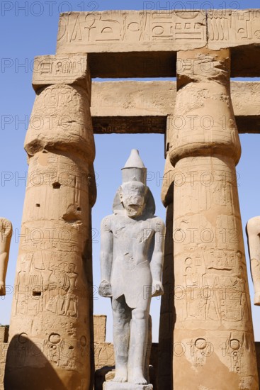 Statue and colonnade, Luxor Temple, Luxor, Egypt