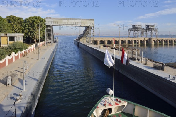 Nile cruise ship enters the lock at the Esna dam, Esna, Egypt