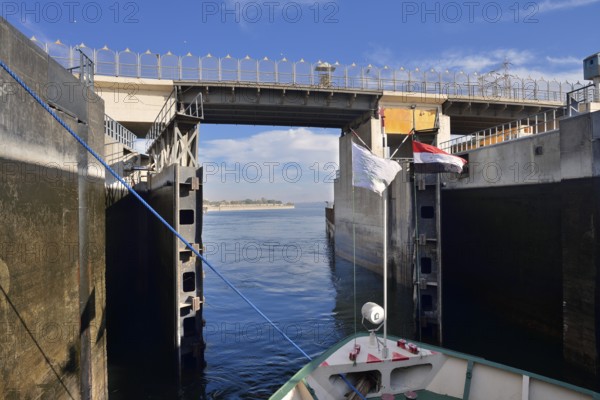 Nile cruise ship leaves the lock at the Esna dam, Esna, Egypt