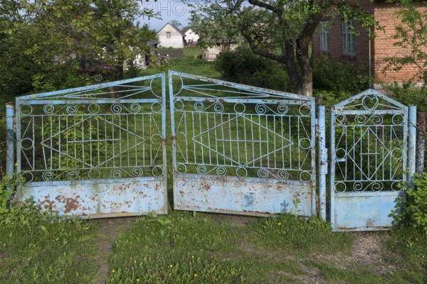 Old garden gate in front of a plot of land in the former Dornfeld from 1789-1939, today Ternopillja, Ukraine
