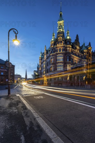 Speicherstadtrathaus in Speicherstadt with road traffic at the blue hour, Hamburg, Germany