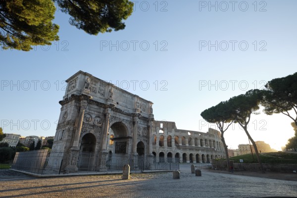 Arch of Constantine and Colosseum at sunrise, Rome, Lazio, Italy