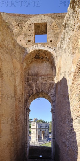 View through round arch of Constantine's Arch from the Colosseum, Rome, Lazio, Italy