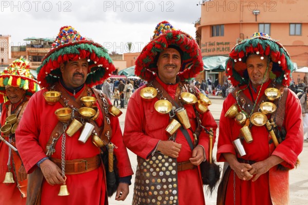 Traditional water sellers on Djemaa el Fna, Hanged Square, Gauklerplatz, Marrakech, historic old town, Medina, UNESCO World Heritage Site, Morocco