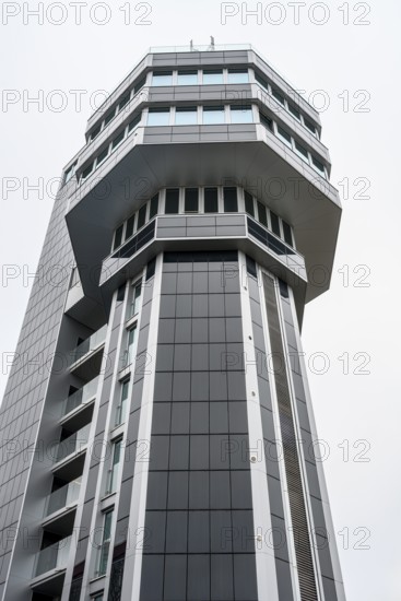 Modern architecture, geometric lines, former water tower of the Radolfzell dairy plant, converted into the Hotel Aqua-Turm since 2017. The world's first zero-energy passive high-rise building, the entire façade consists of around 1000 photovoltaic modules and uses solar thermal energy wind power and hydrothermal energy to produce more energy than it consumes, Konstanz district, Baden-Württemberg, Germany