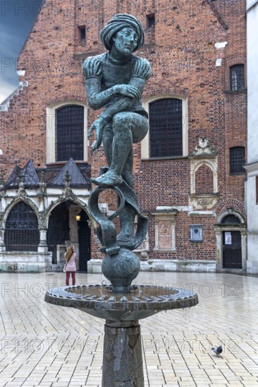 Fountain by Jan Budzillo, figure of a student, copy of a figure from the Marian Altar, Main Market Square, Krakow, Poland