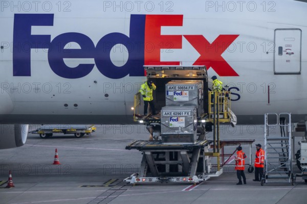 FedEx Express Boeing 777-FS2 cargo plane is unloaded, air freight container, air freight center at Cologne/Bonn airport, North Rhine-Westphalia, Germany