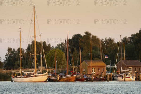 Sunset with boat on the lagoon near Gager on Rügen, Rügen, Gager, Mecklenburg-Western Pomerania, Germany