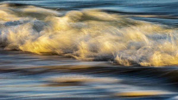 Wave play at sunrise on the chalk coast in Jasmund National Park, Rügen, Sassnitz, Mecklenburg-Western Pomerania, Germany