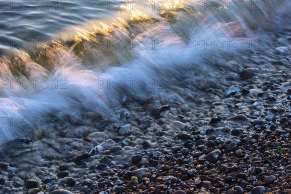 Wave play at sunrise on the chalk coast in Jasmund National Park, Rügen, Sassnitz, Mecklenburg-Western Pomerania, Germany