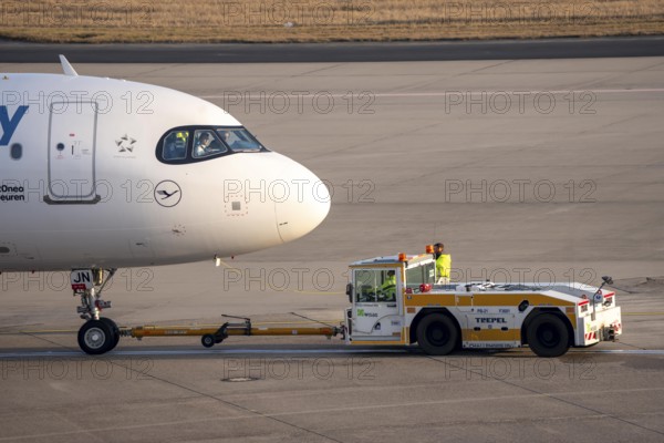 Lufthansa City Airbus A320neo is pushed from the gate onto the taxiway, ready to go, to Cologne/Bonn Airport, CGN, North Rhine-Westphalia, Germany