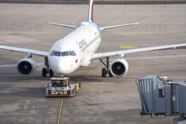 Eurowings Airbus is pushed from the gate onto the taxiway, ready to go, to Cologne/Bonn Airport, CGN, North Rhine-Westphalia, Germany