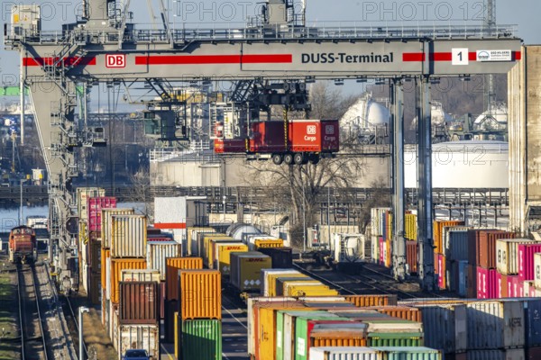 The port of Mannheim is one of the most important inland ports in Europe. The harbor basins stretch across the Rhine and Neckar. DUSS Terminal Deutsche Bahn AG with container from DB Cargo in the Mühlauhafen container terminal. Mannheim, Baden-Württemberg, Germany