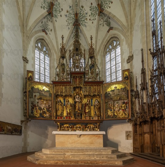 Mother of God on the crescent moon with baby Jesus, elevated on a pedestal, left and right John the Baptist and John the Evangelist, high altar, shrine and predella, chancel with movable pair of double wings suitable for the festivals of the church year, choir room, Blaubeuren Abbey, Swabian Alb, Baden-Württemberg, Germany