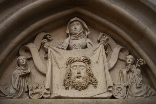Woman in medieval clothing holding cloth with the face of Christ, stone figure, choir room, Blaubeuren Abbey, Swabian Jura, Baden-Württemberg, Germany