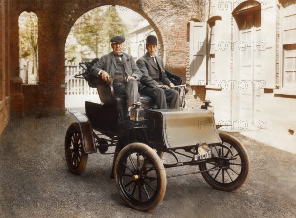 Thomas Edison and Mr. Greenfeldt in a Baker electric automobile, 1910, digitally edited