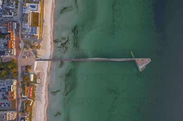 Aerial view over Seebrücke, pier and sandy beach at seaside resort Scharbeutz along the Baltic Sea, Ostholstein, Schleswig-Holstein, Germany