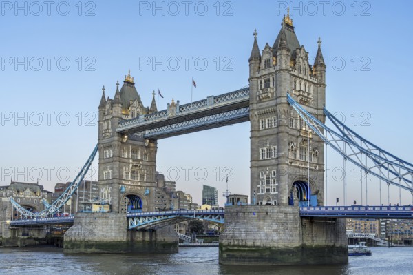 19th century Tower Bridge, neo-Gothic bascule / suspension bridge crossing the River Thames in the capital city London, England, UK