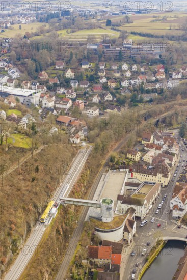 Panorama of city with railroad tracks, hills and river, surrounded by dense residential development, acceptance of the Hermann Hesse Railway, Calw, Black Forest, Germany