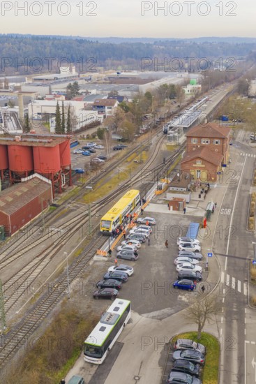 Rural area with a yellow train on the rails, surrounded by meadows and farmhouses, taking the Hermann Hesse Railway, Weil der Stadt, Black Forest, Germany