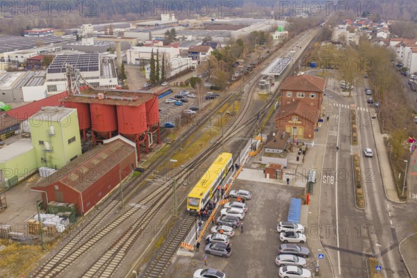Industrial area with train station and train, surrounded by factories and buildings, shows urban winter panorama, acceptance of the Hermann Hesse Railway, Calw, Black Forest, Germany
