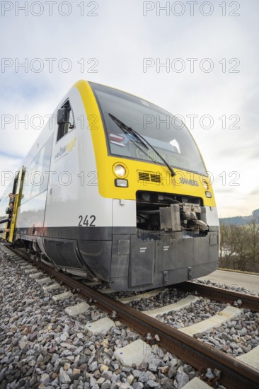 Close-up of a modern SWEG train on the rails, taking off the Hermann Hesse Railway, Calw, Black Forest, Germany