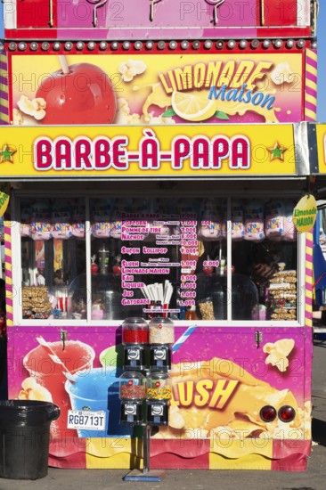 Barbe a Papa cotton candy, popcorn and beverages kiosk with French words at Fun Show traveling amusement ride park, Old Port of Montreal, Quebec, Canada