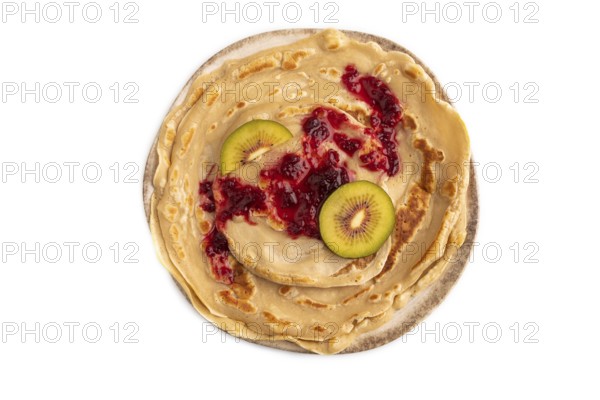 Stack of Plain Fried pancakes with jam and kiwi Isolated on white background. top view, flat lay, close up