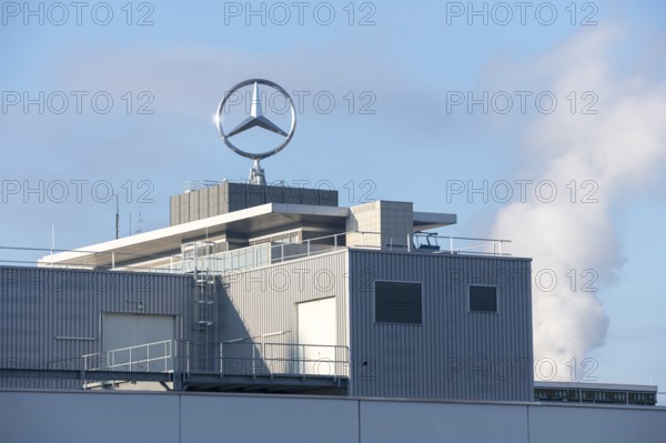 Close-up of a modern building with Mercedes logo and clouds of smoke in the background, blue sky, Mercedes star, Stuttgart-Untertürkheim, Baden-Württemberg, Germany