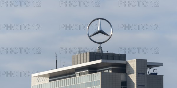 Modern building with Mercedes-Benz logo under cloudy sky, Mercedesstern, Stuttgart-Untertürkheim, Baden-Württemberg, Germany