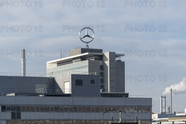 Mercedes-Benz logo on a large industrial complex under cloudy sky, Mercedesstern, Stuttgart-Untertürkheim, Baden-Württemberg, Germany