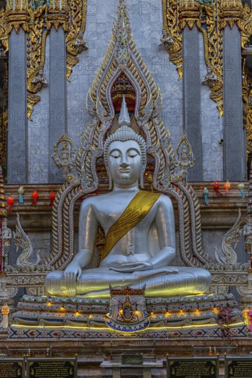 Richly decorated Buddha statue at Wat Suthiwararam Buddhist temple, Bangkok, Thailand's metropolis, Thailand