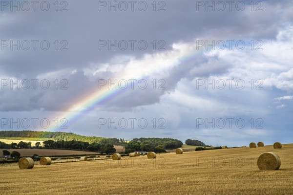 Rainbow over Straw bales, Scottish fields, Southeast Scotland, UK