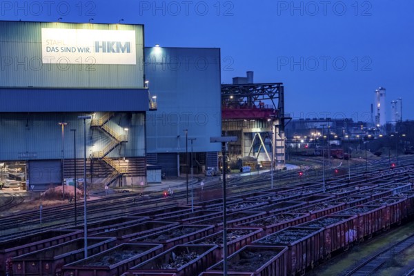 Hüttenwerke Krupp-Mannesmann, HKM in Duisburg, halls of the blast steel mill, tracks of the marshalling yard, freight wagon with scrap metal, to melt down, North Rhine-Westphalia, Germany